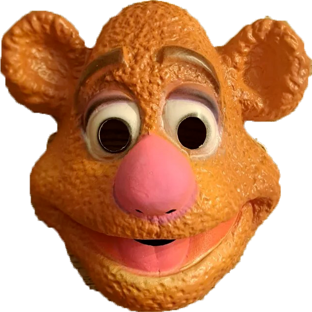Masque souriant avec cheveux blancs et moustache, teint orange.